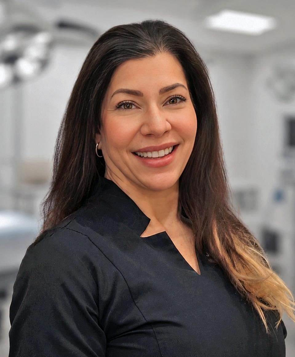 Smiling woman in a professional setting.