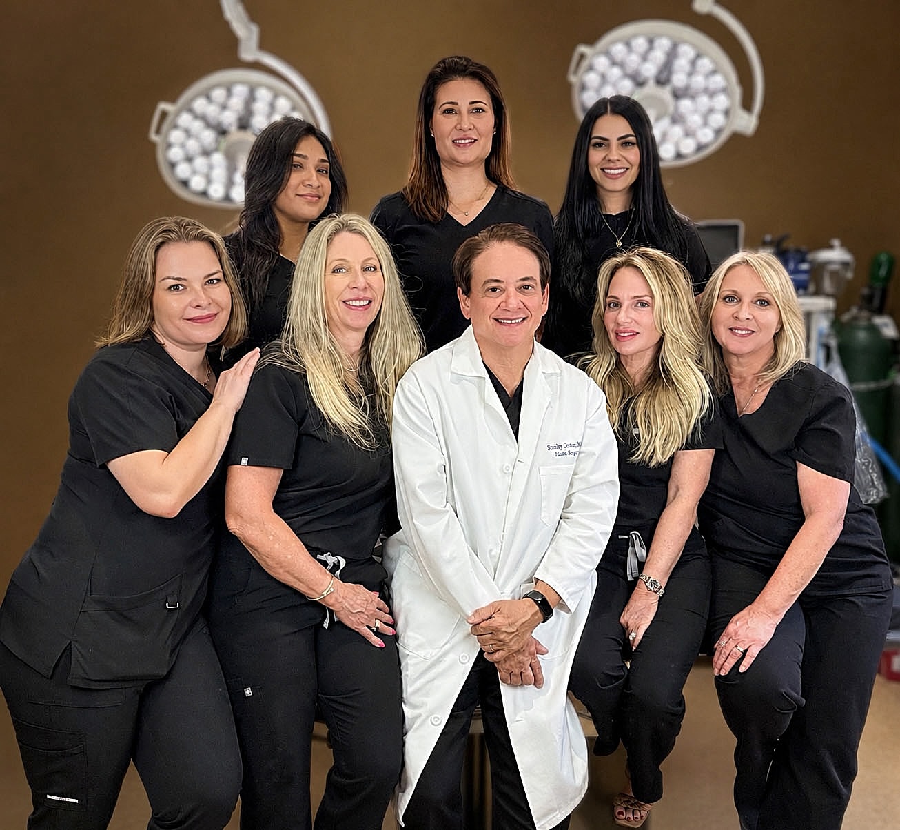 Medical team posing together in scrubs.